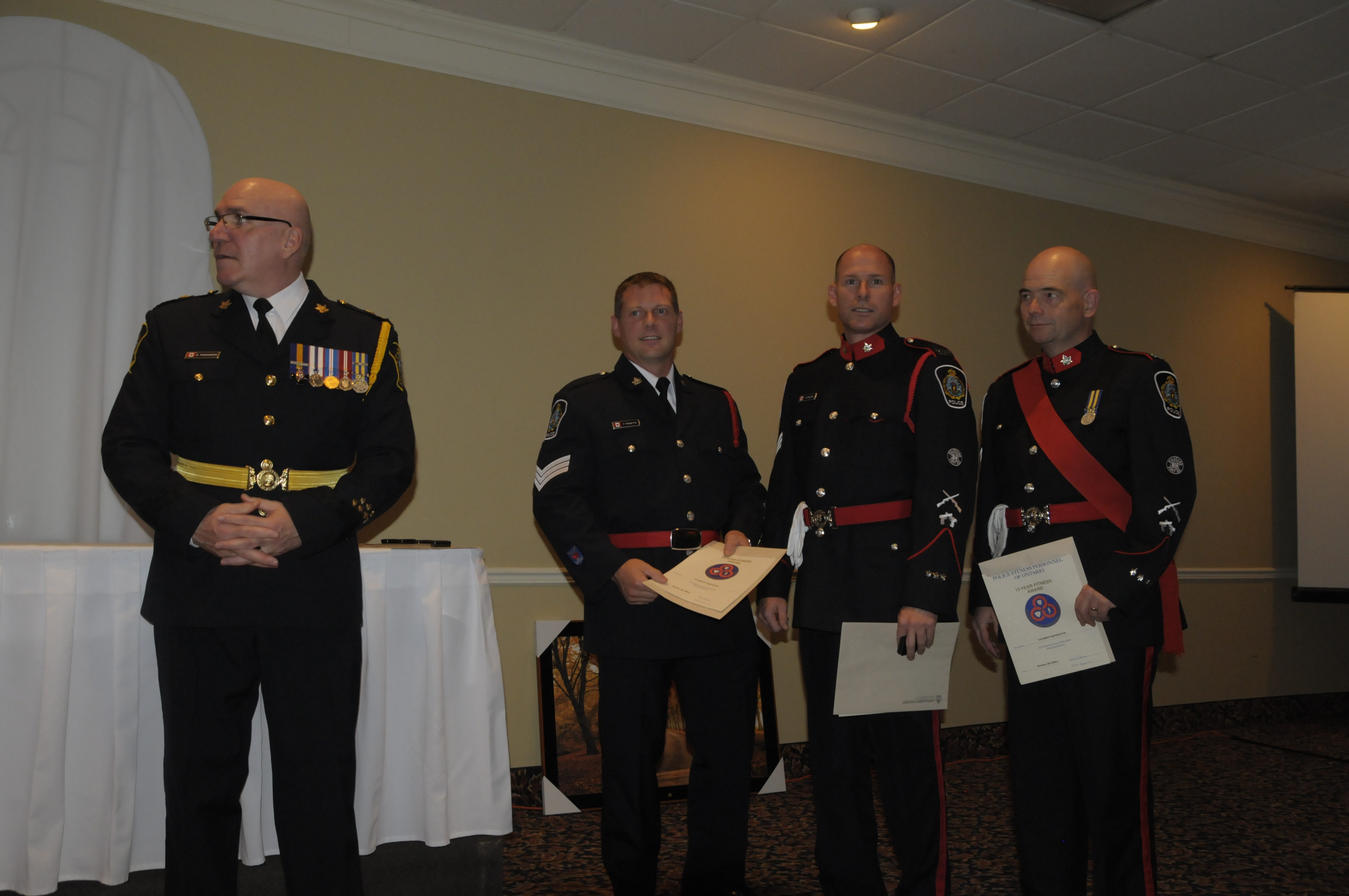 Police Chief Dan Parkinson (left) with the 15 year police fitness award recipients. They are (from left) are Const. Patrick Paquette, Sgt. Scott Coulter and Sgt. George Knezevic. (Cornwall Newswatch)