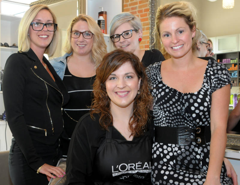Employees at The Loft Salon are fundraising to help a family whose baby is being treated for a stage four brain cancer. Pictured, from back left, Milaine Boyer, Alex Besner, Jessica O'Brien, Melissa Cameron Mainville and, front center, Chantale Leger. (Cornwall Newswatch/Bill Kingston)