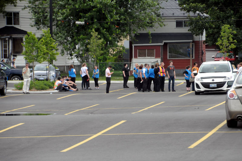 Cornwall Walmart associates stand in the northeast corner of the parking lot on Ninth Street and Cumberland Street after the store received a bomb threat July 18, 2015. (Cornwall Newswatch/Bill Kingston)