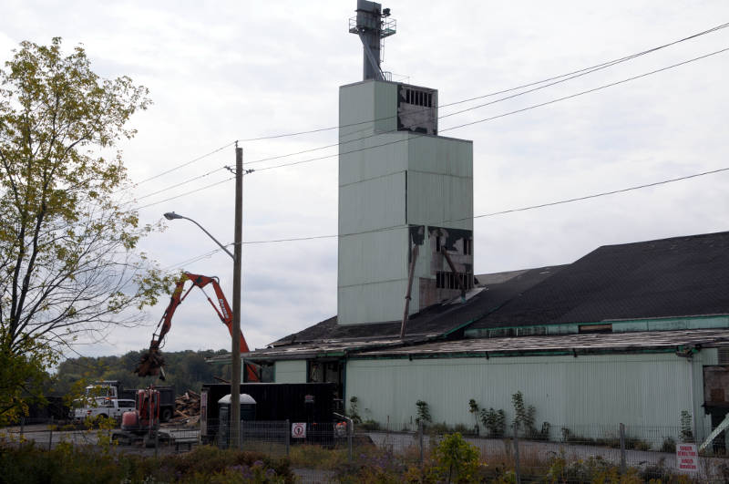 A demolition crew loads some rubble into a truck on Sept. 29, 2015 as demolition of the SynAgri plant on Frontenac Street in Cornwall, Ont. got underway this week. The operations have moved to Chesterville, Ont. in a newly expanded facility there. (Newswatch Group/Bill Kingston)