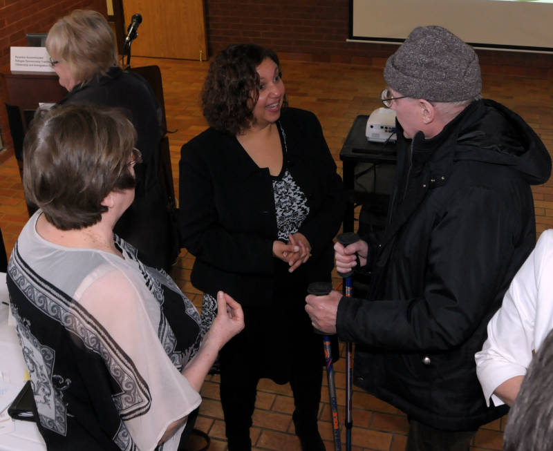 Cornwall Syrian Refugee Task Force chairman Bernadette Clement, center, speaks with a couple attendees a a public meeting Wednesday Feb. 17, 2016 at the Cornwall Civic Complex. The task force is now gathering a list of resources available in the community should a Cornwall group become a successful sponsor. (Newswatch Group/Bill Kingston)