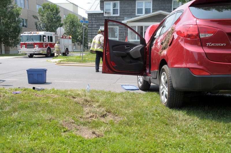 Large clumps of dirt are wedged in the back door of an SUV Wednesday, July, 20, 2016 after the truck flipped during a collision at the intersection of First and York Streets in Cornwall, Ont. Seven people -- two in the SUV and five in a Cornwall Transit bus -- were taken to hospital as a precaution. (Newswatch Group/Bill Kingston)
